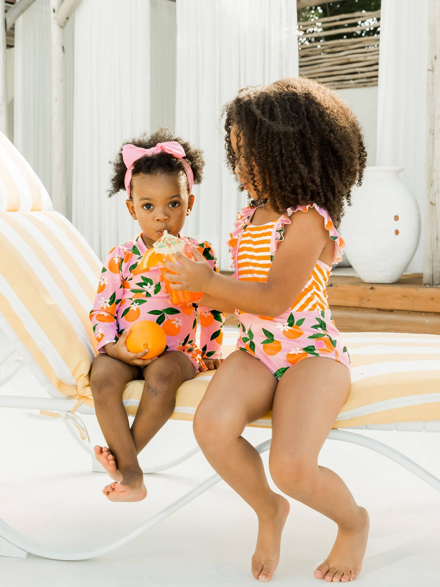 RuffleButts + RuggedButts - Girls Orange You The Sweetest Pinafore One Piece