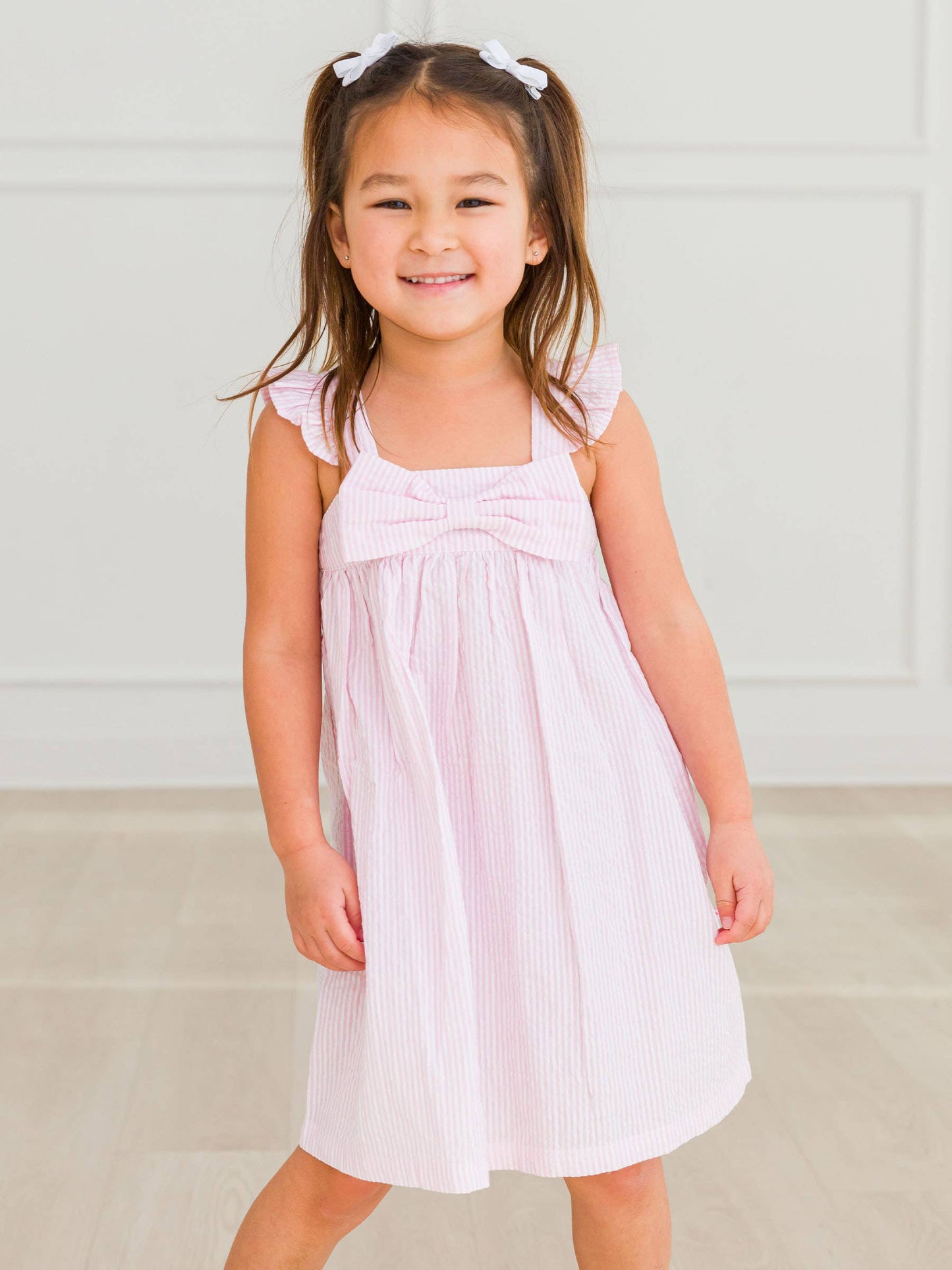 RuffleButts + RuggedButts - Girls Pink Seersucker Flutter Bow Woven Dress