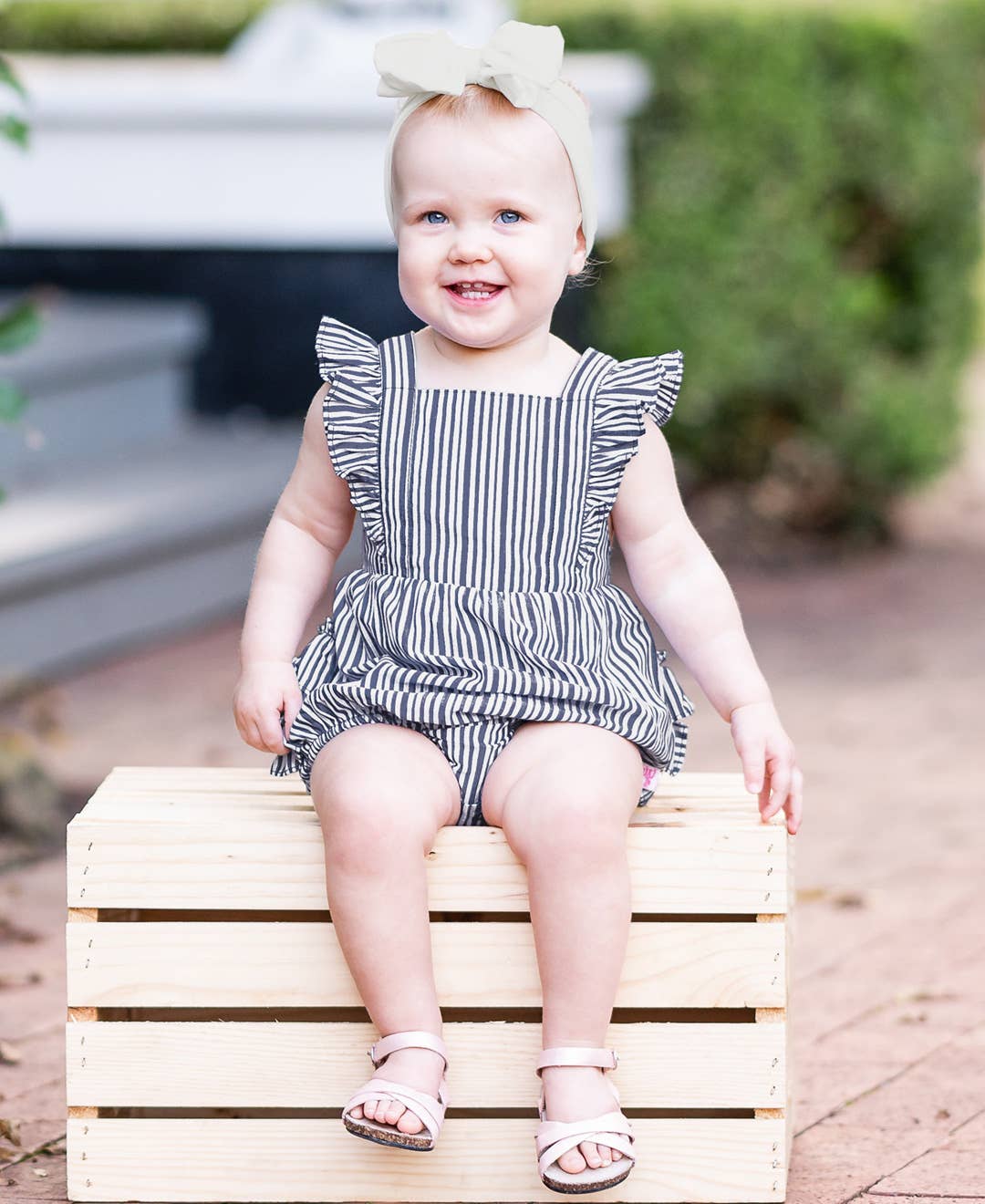 RuffleButts + RuggedButts - Baby Girls Navy Micro Stripe Woven Pinafore Cross-Back Bubble Romper