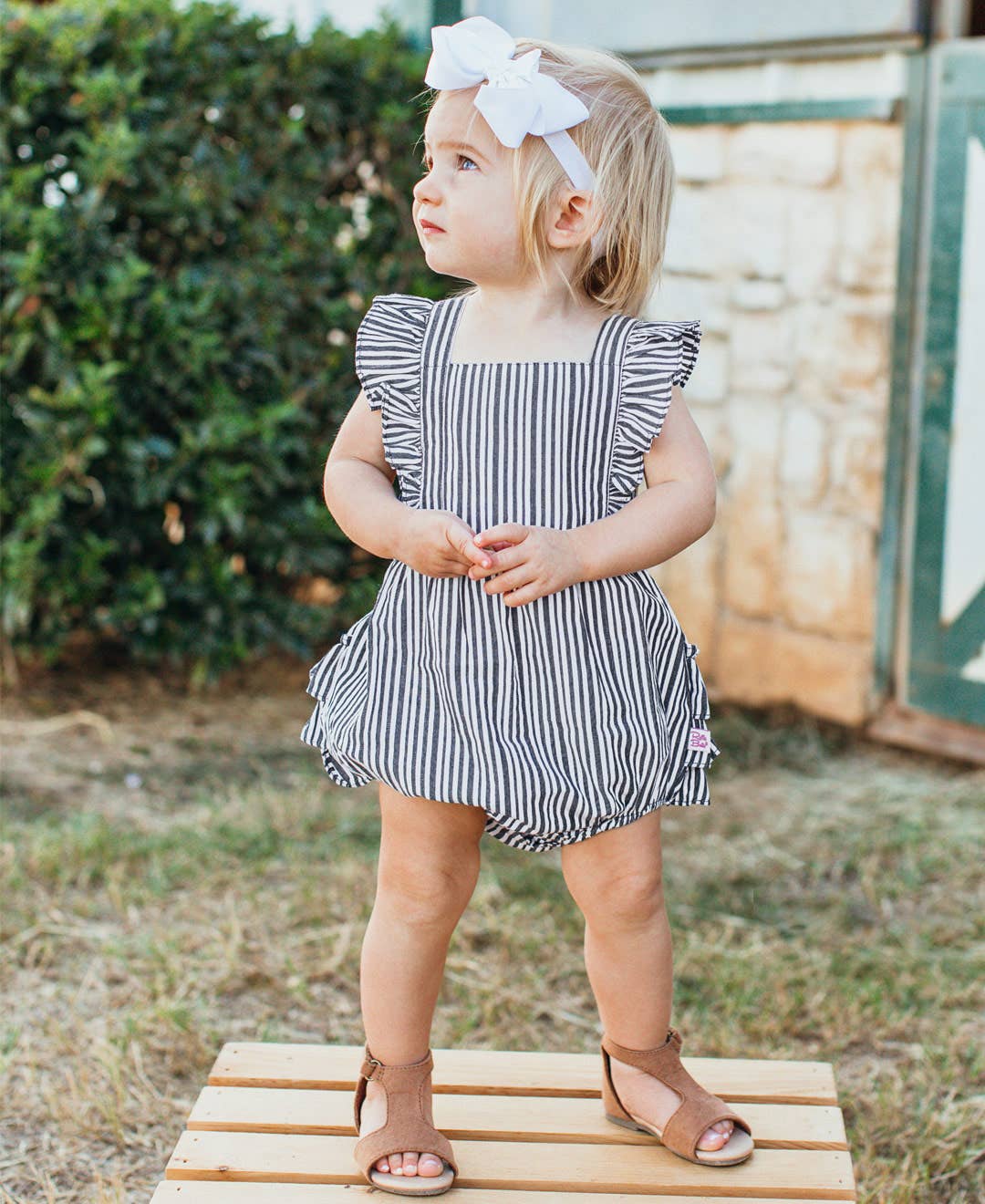 RuffleButts + RuggedButts - Baby Girls Navy Micro Stripe Woven Pinafore Cross-Back Bubble Romper