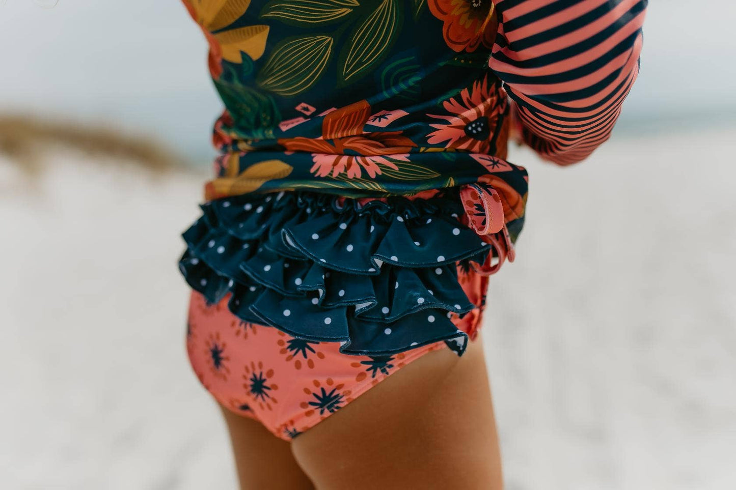 Oopsie Daisy - Kids Long Sleeve Navy Tropical Rash Guard Ruffle Swimsuit