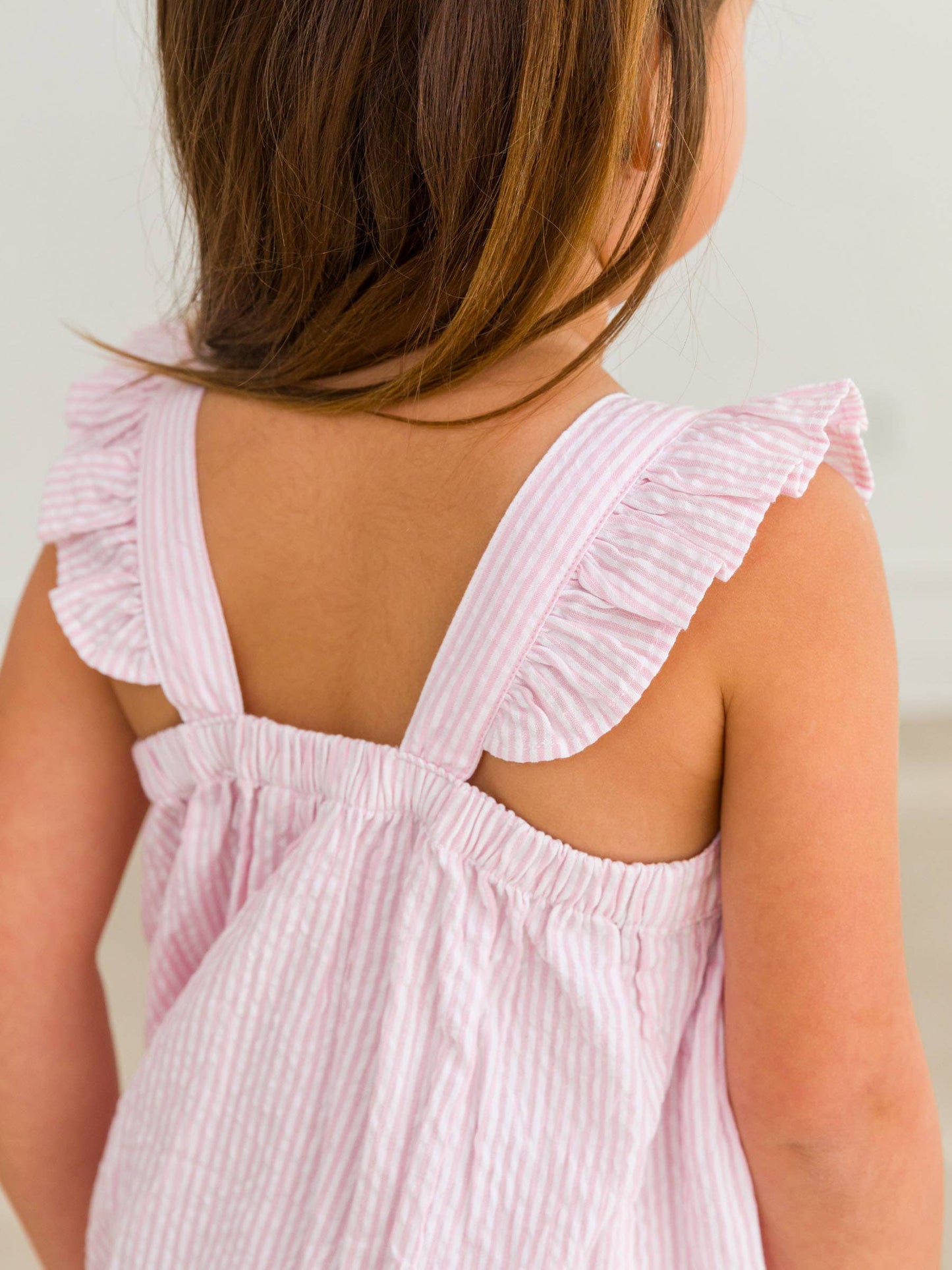 RuffleButts + RuggedButts - Girls Pink Seersucker Flutter Bow Woven Dress